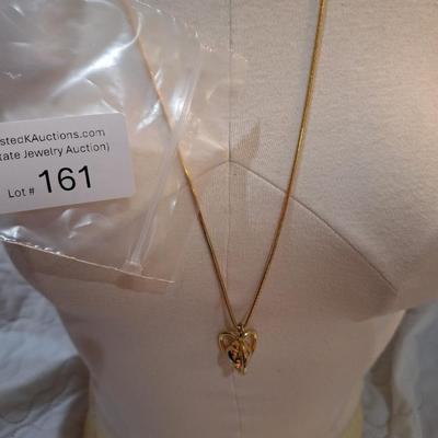 Sale Photo Thumbnail #716: long gold tone necklace with pendant