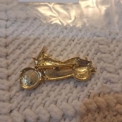 Sale Photo Thumbnail #764: motorcycle brooch- gold tone, signed "jj"