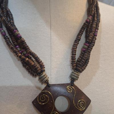 Sale Photo Thumbnail #786: large statement necklace with geometric pendant and dangles.