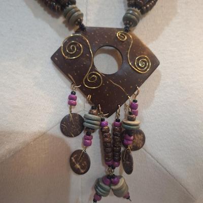 Sale Photo Thumbnail #785: large statement necklace with geometric pendant and dangles.