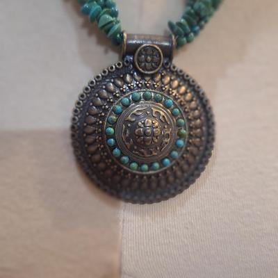 Sale Photo Thumbnail #812: Rock chip necklace with large round pendant