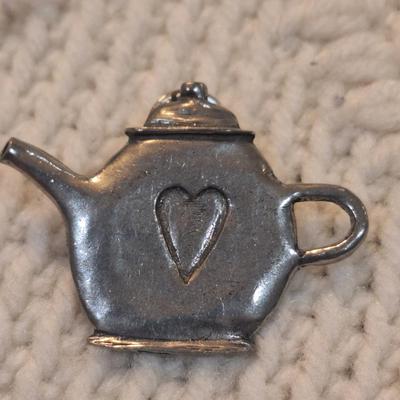 Sale Photo Thumbnail #825: silver tone lapel pin and other item- possible scarf ring
