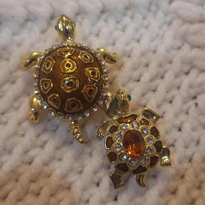Sale Photo Thumbnail #857: double turtle pendant- gold tone no markings