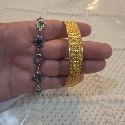 Sale Photo Thumbnail #888: 2 bracelets, silver tone bears and gold tone cuff