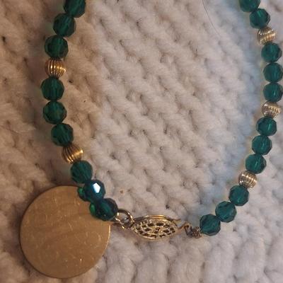 Sale Photo Thumbnail #921: green and gold tone bracelet and lapel pin