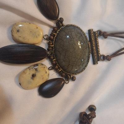 Sale Photo Thumbnail #1255: Long necklace with oval rock pendant and matching earrings