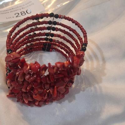 Sale Photo Thumbnail #1260: multistrand bracelet with seed beads and rock chips- red