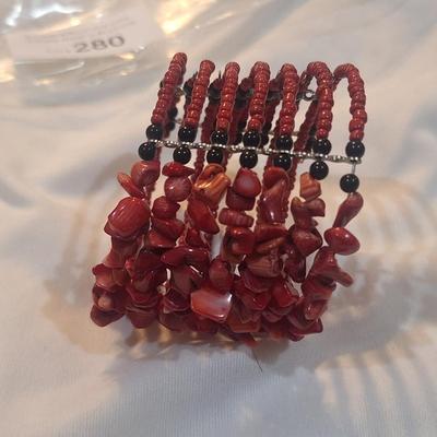 Sale Photo Thumbnail #1259: multistrand bracelet with seed beads and rock chips- red