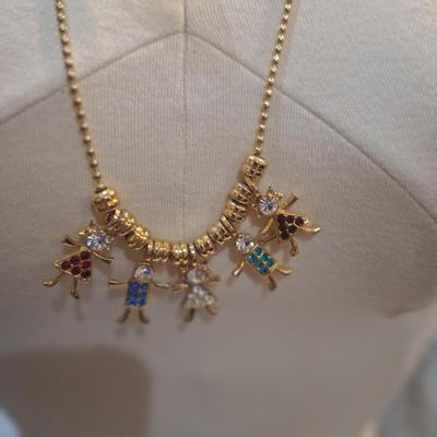Sale Photo Thumbnail #1272: Kirks folly necklace on long chain with birthstone children charms