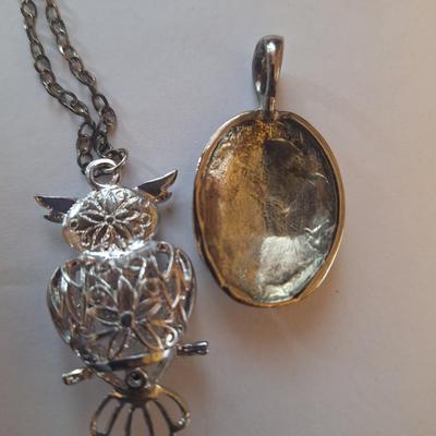 Sale Photo Thumbnail #1380: Owl pendant on silver tone chain and black and silver tone oval pendant