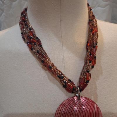 Sale Photo Thumbnail #1416: beaded necklace with large statement pendant- pinks and reds