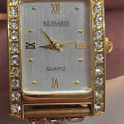 Sale Photo Thumbnail #1420: all need new batteries.  all are stretch bands.
the one with the rhinestones has a stone missing, see first photo above the watch 3 positions.