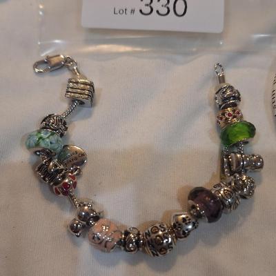 Sale Photo Thumbnail #1426: charm bracelet with charms for son and daughter and other pretty charms