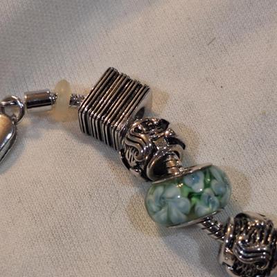 Sale Photo Thumbnail #1429: charm bracelet with charms for son and daughter and other pretty charms