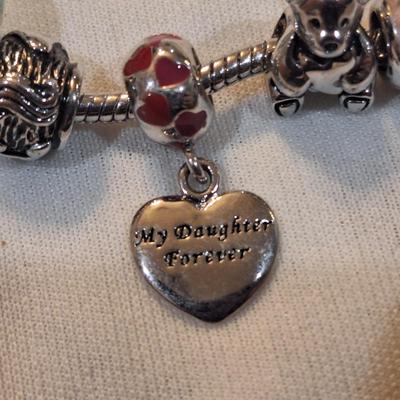 Sale Photo Thumbnail #1431: charm bracelet with charms for son and daughter and other pretty charms