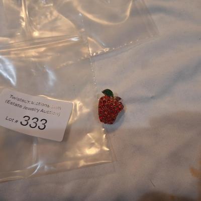 Sale Photo Thumbnail #1448: Apple lapel pin with bite out it.