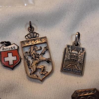 Sale Photo Thumbnail #1484: charms from various destinations and possibly some free mason related.