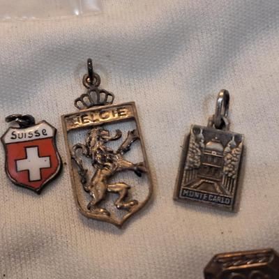 Sale Photo Thumbnail #1483: charms from various destinations and possibly some free mason related.