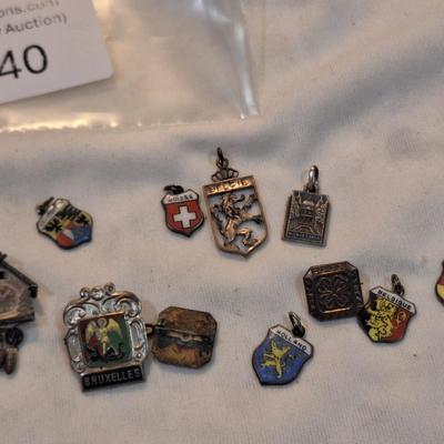Sale Photo Thumbnail #1478: charms from various destinations and possibly some free mason related.