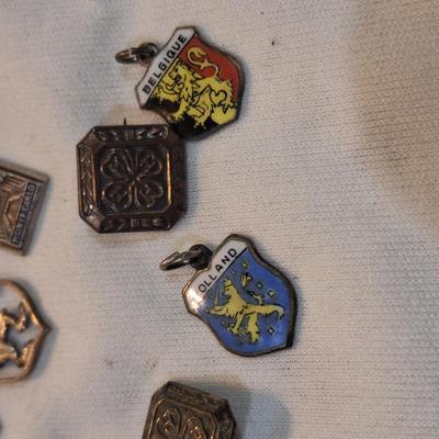 Sale Photo Thumbnail #1481: charms from various destinations and possibly some free mason related.