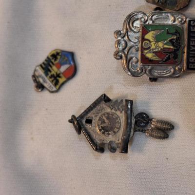 Sale Photo Thumbnail #1479: charms from various destinations and possibly some free mason related.