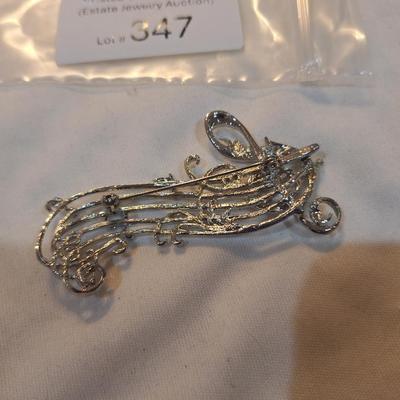 Sale Photo Thumbnail #1520: music staff brooch with treble clef and notes