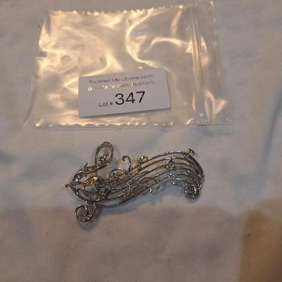 Sale Photo Thumbnail #1517: music staff brooch with treble clef and notes