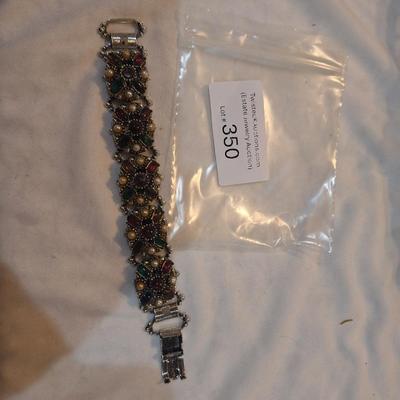 Sale Photo Thumbnail #1529: see photos.  in first picture at the top near the clasp the large center stone is missing.  You have to look to notice it.