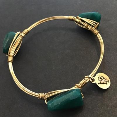 Bourbon and Boweties gold tone bangle bracelet