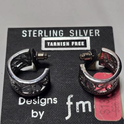 Silver tone Necklace Chain with several pairs of pierced earrings and silver tone bangle bracelet