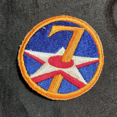 Short "The 7th Air Force" softcover WWII Unit History Book and an Original WW2 Vintage 7th Air force patch