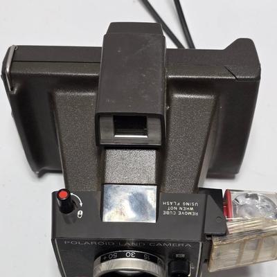 Vintage Polaroid Square Shooter land camera with distance finder and focused Flash in original box with contents and new sealed film.