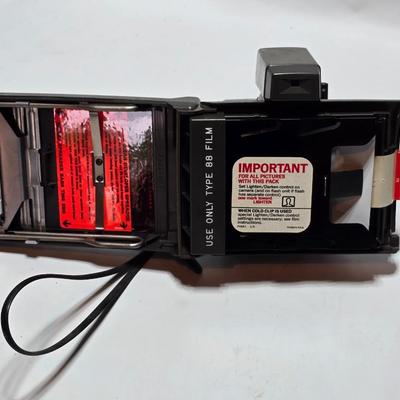 Vintage Polaroid Square Shooter land camera with distance finder and focused Flash in original box with contents and new sealed film.