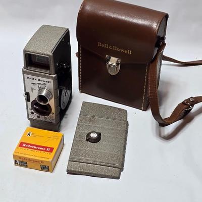 Beautifully clean Bell & Howell Two Twenty Vintage 8 mm Movie Camera with movie film and leather case