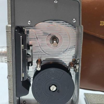 Beautifully clean Bell & Howell Two Twenty Vintage 8 mm Movie Camera with movie film and leather case