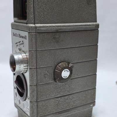Beautifully clean Bell & Howell Two Twenty Vintage 8 mm Movie Camera with movie film and leather case