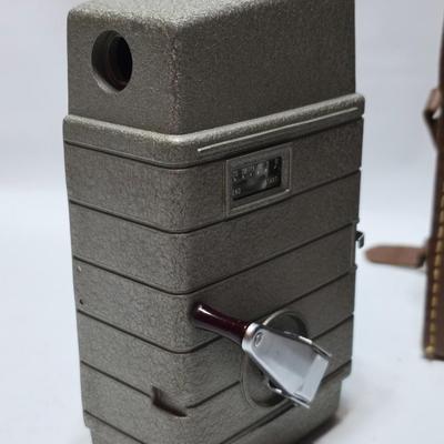 Beautifully clean Bell & Howell Two Twenty Vintage 8 mm Movie Camera with movie film and leather case