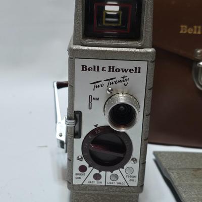 Beautifully clean Bell & Howell Two Twenty Vintage 8 mm Movie Camera with movie film and leather case
