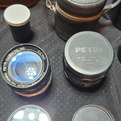 Petri 35MM FTE Camera With several Petri Lenses and nice leather Case and a tri[od