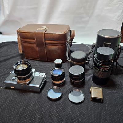 Petri 35MM FTE Camera With several Petri Lenses and nice leather Case and a tri[od