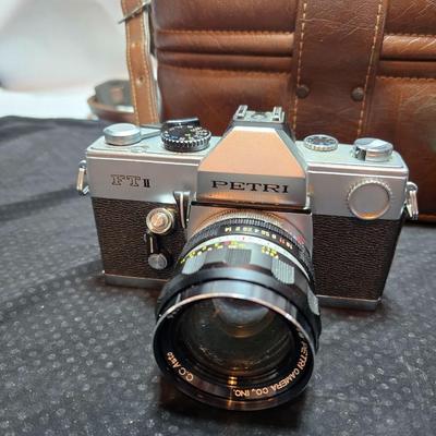 Petri 35MM FTE Camera With several Petri Lenses and nice leather Case and a tri[od
