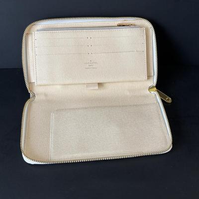 LOT 89: Louie Vuitton Damier Azur Zippy Organizer Long Wallet