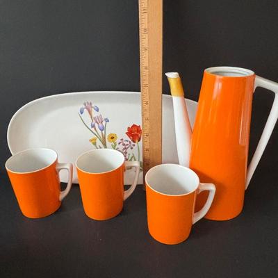 LOT 100: MCM Teapot (missing top), Teacups, Made in USA Green Rim Plates, Saltera Winter Dogwood Plate & More
