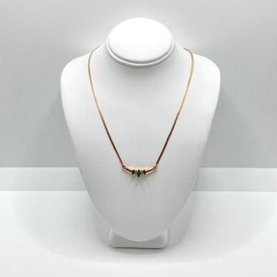 LOT 124: 14k Gold Emerald and Diamond Necklace - 14KT / 585, TW 4.91 gtw