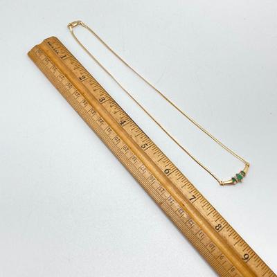 LOT 124: 14k Gold Emerald and Diamond Necklace - 14KT / 585, TW 4.91 gtw