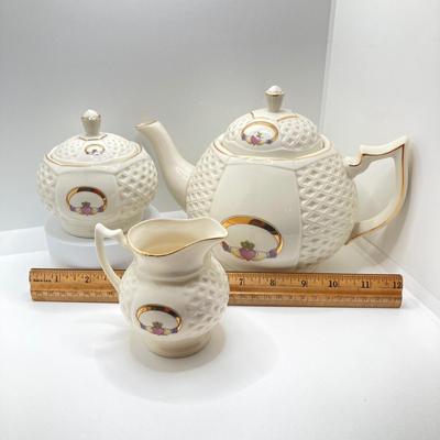 LOT 128: Donegal Ireland Parian China (Millennium 2000 Ad) Claddagh Teapot with Cream and Sugar Bowls