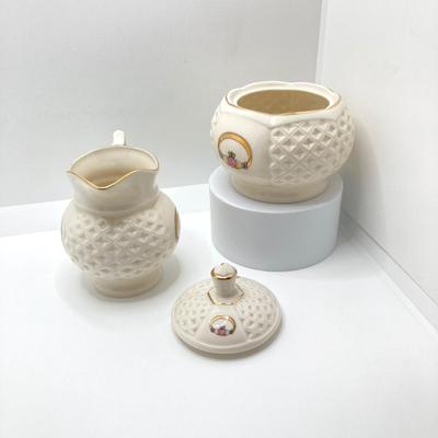 LOT 128: Donegal Ireland Parian China (Millennium 2000 Ad) Claddagh Teapot with Cream and Sugar Bowls