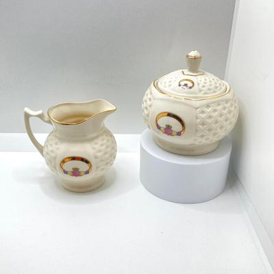 LOT 128: Donegal Ireland Parian China (Millennium 2000 Ad) Claddagh Teapot with Cream and Sugar Bowls