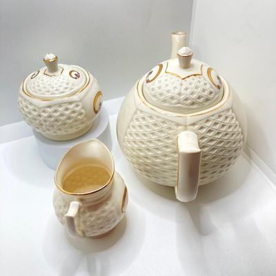 LOT 128: Donegal Ireland Parian China (Millennium 2000 Ad) Claddagh Teapot with Cream and Sugar Bowls