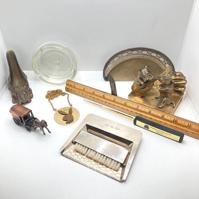LOT 131: Vintage Collection - Dog Brass Book Ends, Pipe Holder, Playboy Ashtray and Necklace, Robeson Pocket Knife, Sheffield Crumb Tray...